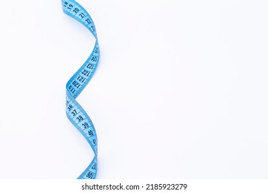 The Photo Shows A Blue Tape Measure Isolated On White Background