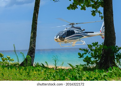 The photo shows a helicopter that brought tourists to the beach to relax. A business aviation helicopter was trying to land directly on the sand. It can be seen how the blades cut through the air.