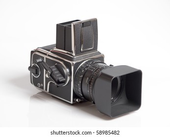 The photo shows a medium format camera over white