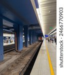 The photo shows the platform at the railway station.Central Station in Warsaw.