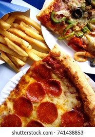 Photo Of Slices Of Pizza On A Plate And French Fries