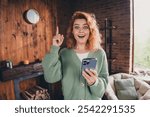 Photo of smart clever woman dressed green cardigan pointing finger texting modern gadget indoors house apartment room