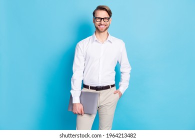 Photo Of Smart Cool Happy Man Hold Hand Computer Pocket Wear Glasses Isolated On Blue Color Background