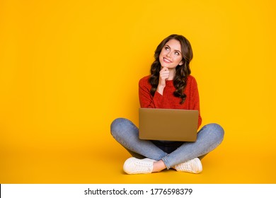 Photo of smart curious student in red pullover using netbook to write email to her friend making up story isolated over yellow background with copy space - Powered by Shutterstock