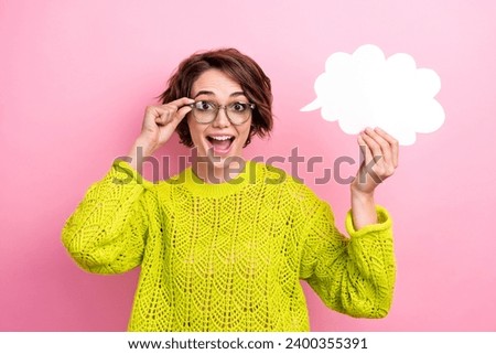 Photo of smart girl shocked she has great idea touch eyeglasses holding paper bubble cloud new invention isolated on pink color background