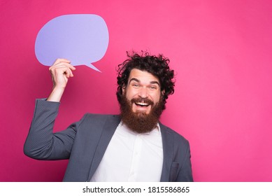 Photo of smiling bearded man in casual holding empty speech bubble - Shutterstock ID 1815586865