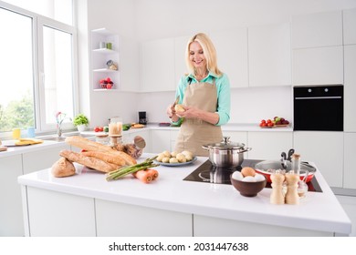 Photo of smiling cheerful gorgeous housewife grandma peeling potatoes prepare lunch delicious garnish at home house - Powered by Shutterstock