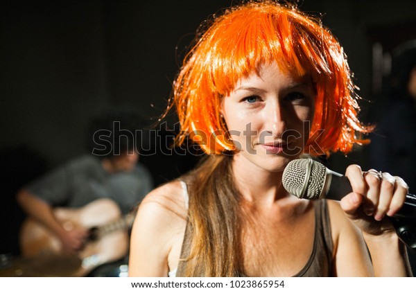 Photo Smiling Female Singer Wearing Orange Stock Photo Edit Now