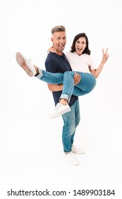 Photo of a smiling happy positive adult loving couple isolated over white wall background having fun. - Shutterstock ID 1489903184