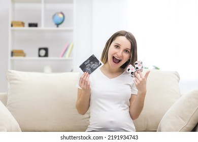 Photo Of Smiling Pregnant Woman With Ultrasound Result.