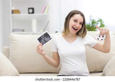 Photo Of Smiling Pregnant Woman With Ultrasound Result.