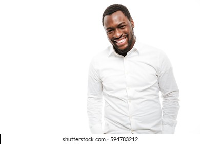 Photo Of Smiling Young African Man Dressed In Shirt Standing Isolated Over White Background.