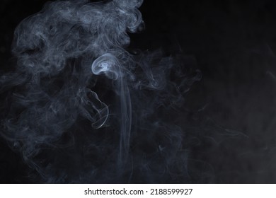 Photo of smoke on a dark background, close-up. Colored smoke - Shutterstock ID 2188599927