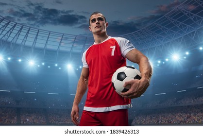 Photo of a soccer player who holds the ball.He wear unbranded sports clothes. Stadium and crowd made in 3D.