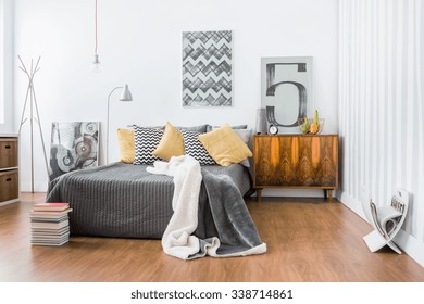 Photo of spacious room with double bed and floor panels