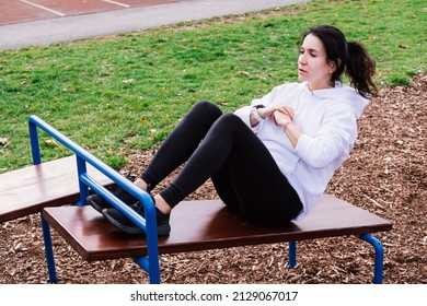 Photo Of A Sporty Woman Pumping Press On The Sports Ground.