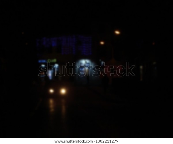                         Photo of street in\
the dark with blur effect.      \
