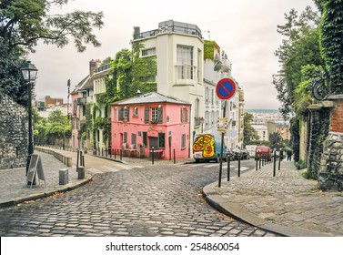 photo of a street in Montmartre, Paris, France, in a warm light and light toning