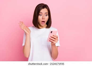Photo of stressed negative mood girl blogger influencer see bad comment dislike isolated on pink color background