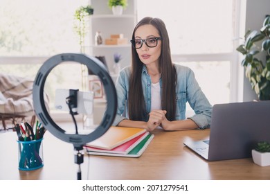 Photo of strict brunette young lady wear jeans shirt do video blog work from home alone - Powered by Shutterstock