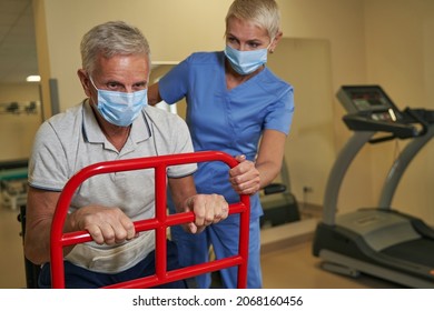 Photo Of Stroke Person Using Walking Frame In Medical Clinic