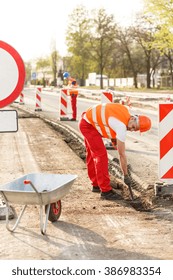 Photo Of Strong Blue Collar Worker Labouring Hard