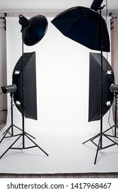 Photo Studio Equipment And White Paper Background Indoors, No People