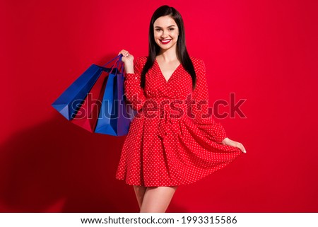 Photo of stunning brunette lady hold bags wear red dress isolated on vivid color background