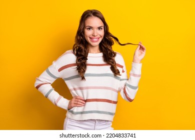 Photo Of Stunning Lovely Lady Toothy Smile Arm Hold Play Hair Curl Isolated On Yellow Color Background