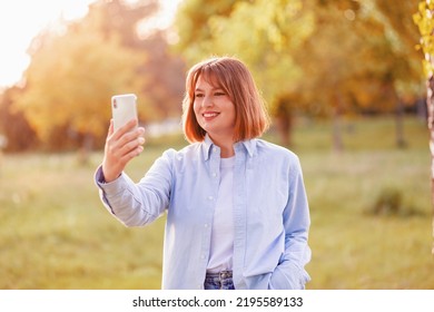 Photo Of Stunning Positive Wavy Hairdo Lady Make Selfie Recording Video Evening Sunset Street Outside