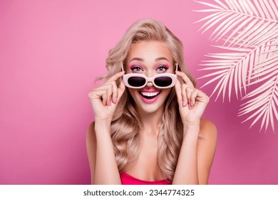 Photo of stunning sweet girl surprised new toy doll promo summer collection presenting on pink background - Shutterstock ID 2344774325