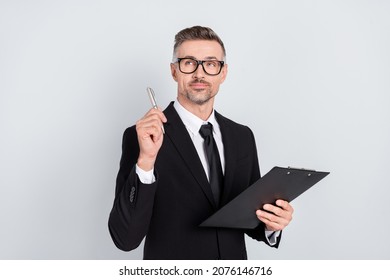 Photo of stylish broker ceo guy hold clip board touch pen empty space start-up promotion isolated over grey color background - Powered by Shutterstock