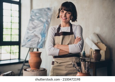 Photo of successful lady potter cross hands have artistic hobby learn artwork making porcelain product inspiration in workroom - Powered by Shutterstock