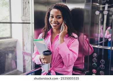 Photo of successful young business woman speak phone elevator wear shirt modern business center office indoors - Powered by Shutterstock