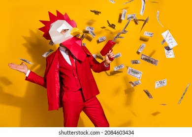 Photo of surreal guy hold pistol throw jackpot lottery wear cock mask red suit isolated yellow color background