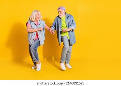 Photo Of Sweet Adorable Husband Wife Wear Jeans Shirts Dancing Empty Space Isolated Yellow Color Background