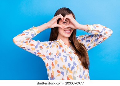 Photo of sweet adorable young lady wear print shirt smiling showing hands arms heart close eye isolated blue color background