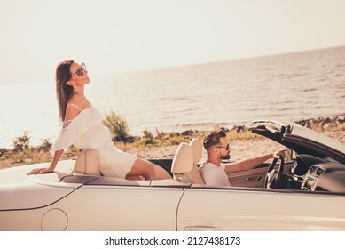 Photo Of Sweet Charming Married Couple Dressed White Clothes Driving Car Smiling Outdoors Country Side Road