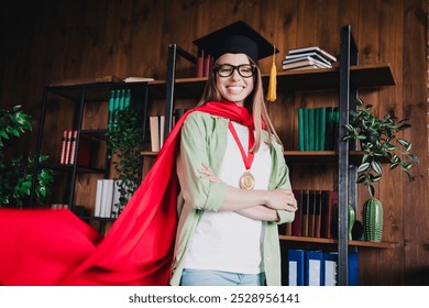 Photo of sweet charming school girl wear shirt glasses mortarboard arms folded indoors auditorium - Powered by Shutterstock