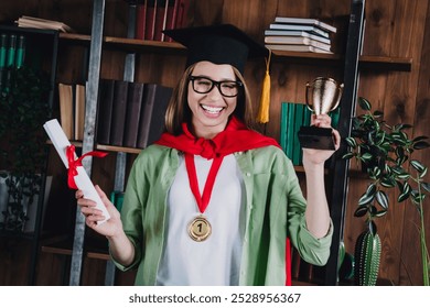 Photo of sweet charming school girl wear shirt glasses mortarboard rising diploma indoors auditorium - Powered by Shutterstock