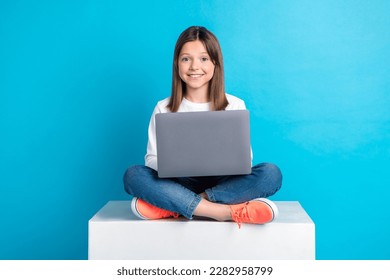 Photo of sweet charming small lady dressed white shirt chatting instagram twitter facebook isolated blue color background