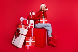 Photo Of Sweet Charming Young Lady Dressed Print Pullover Preparing Christmas Presents Looking Empty Space Isolated Red Color Background