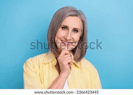 Photo of sweet cheerful lady wear yellow shirt arm chin smiling isolated blue color background