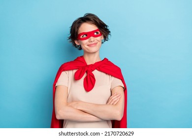 Photo of sweet confident lady dressed red mantle arms crossed looking empty space isolated blue color background