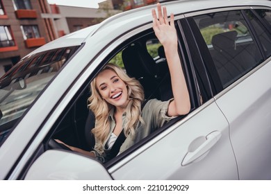 Photo Of Sweet Cute Lady Plan Route Trip Car Rest Relax Ride Show Wave Palm Hi Hello Goodbye Outdoors