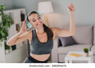 Photo Of Sweet Funny Girl Dressed Sport Suit Back Chair Practicing Zumba Smiling Indoors House Home