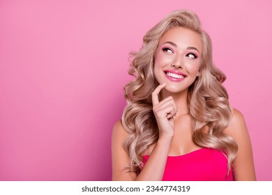 Photo of sweet girly adorable lady thinking about doll hen party occasion over pastel pink color background