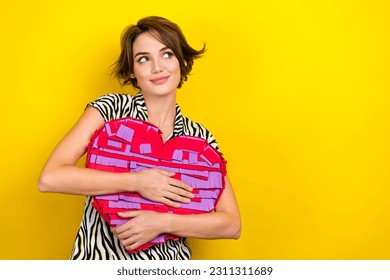 Photo of sweet lovely girl with bob hairdo dressed zebra print shirt hug big heart look empty space isolated on yellow color background - Shutterstock ID 2311311689