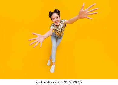 Photo of sweet pretty lady dressed print t-shirt dancing open arms catching you isolated yellow color background