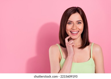 Photo of sweet shiny young girl dressed green outfit smiling finger chin isolated pink color background - Shutterstock ID 2215609193